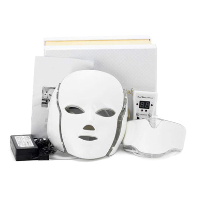 White LED face mask with power adapter on a white background