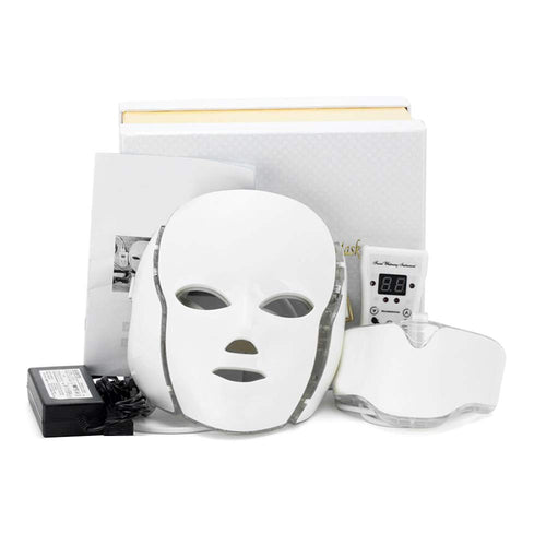 White LED face mask with power adapter on a white background