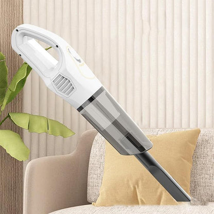 Handheld vacuum cleaner on a couch with a neutral background